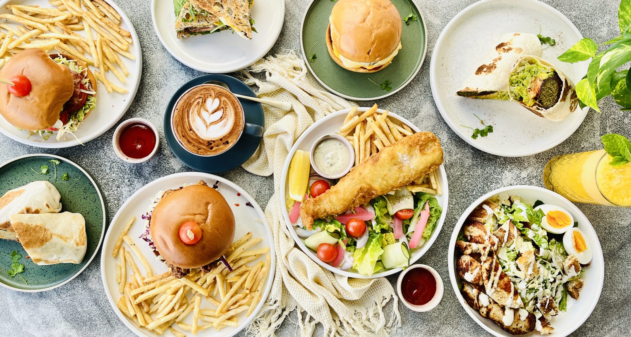 Burgers, fish and chips, falafel wrap, chicken Caesar salad and a latte at Cafe Berlin